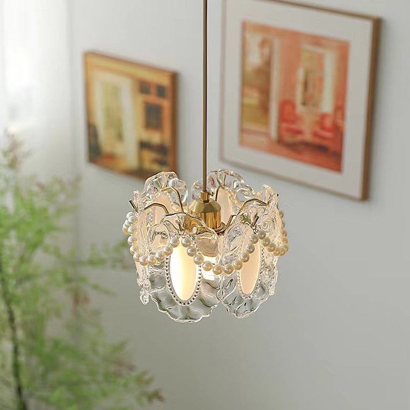 White glass pendant lights with a unique shell-like design in a contemporary interior.