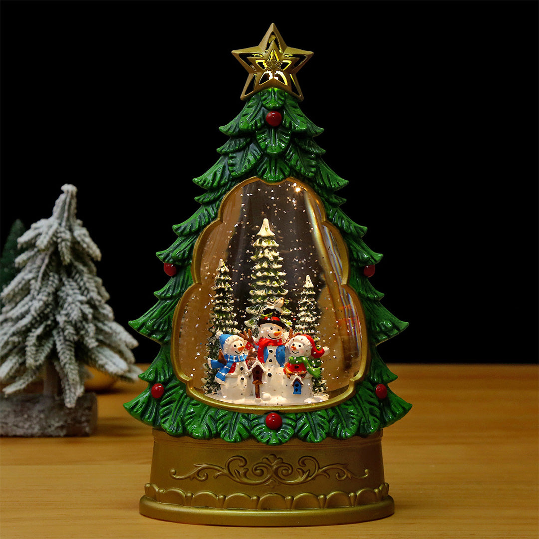White glass table lamp with frosted dome and metallic tree decorations surrounded by candles and ornaments