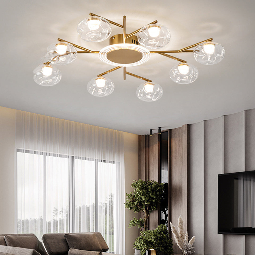 White and gold sputnik pendant light illuminating modern bedroom with minimalist decor and natural lighting