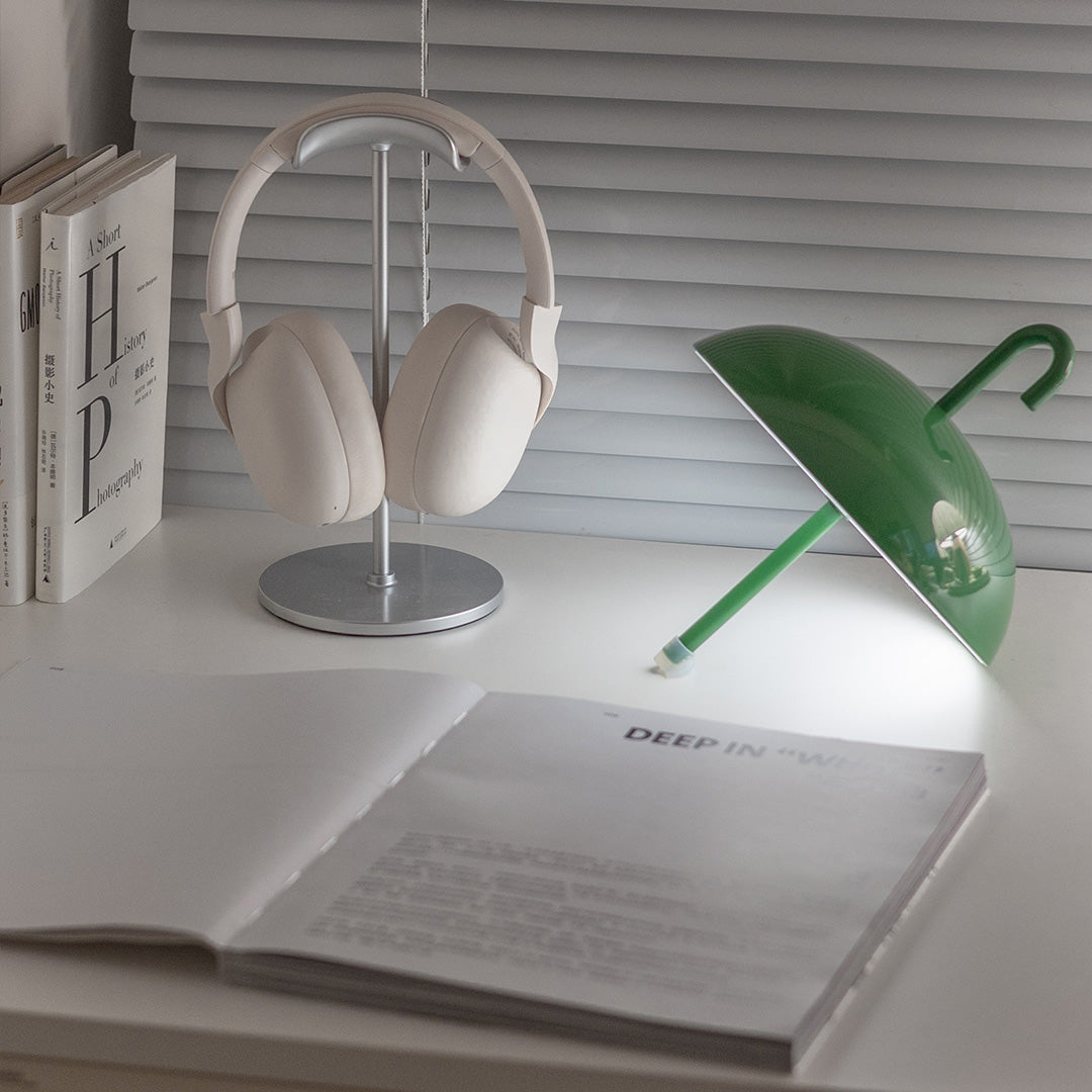 White and green USB rechargeable table lamp pair on modern desk workspace