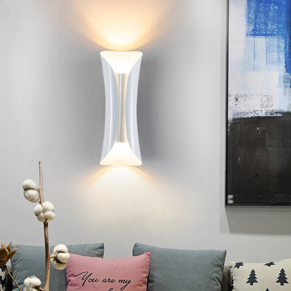 White indoor up down wall lights creating soft ambient glow in living space.