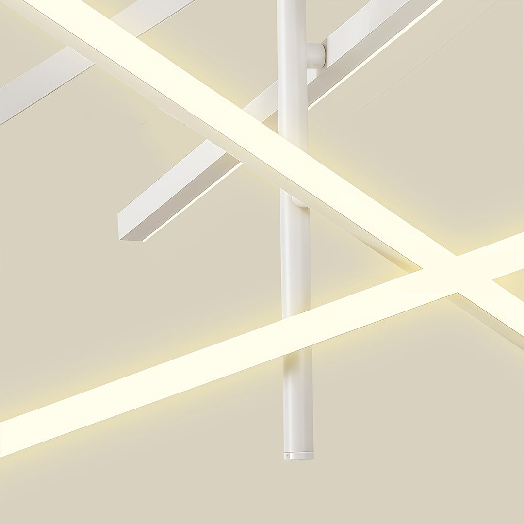 White iron linear chandelier with crossed arms creating bright ambient lighting in modern space.