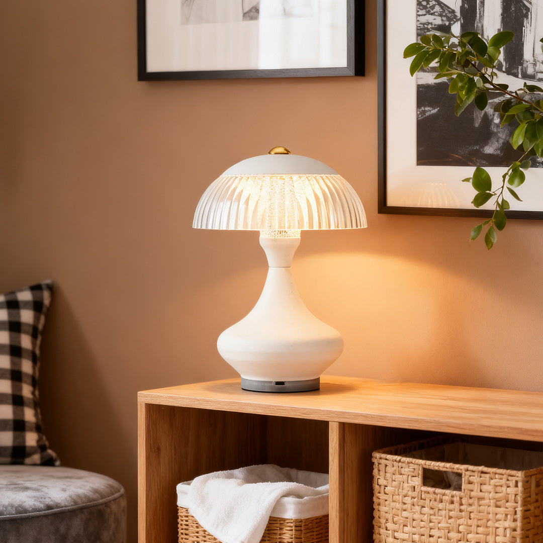 White mushroom table unique lamps with a clear ribbed shade placed on a light wood console table.