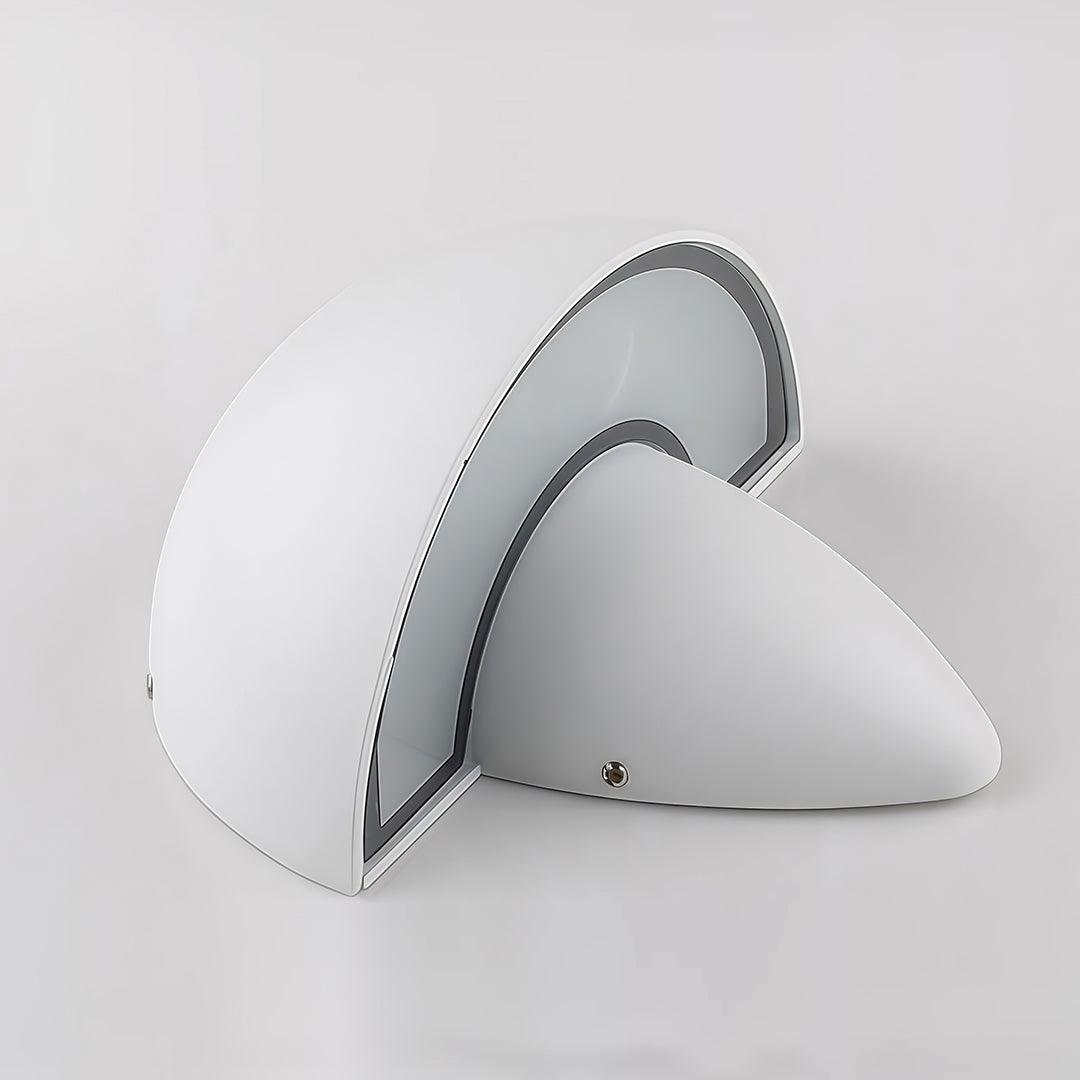White mushroom wall light mounted in a hallway, offering ambient light and a modern look to the interior space.