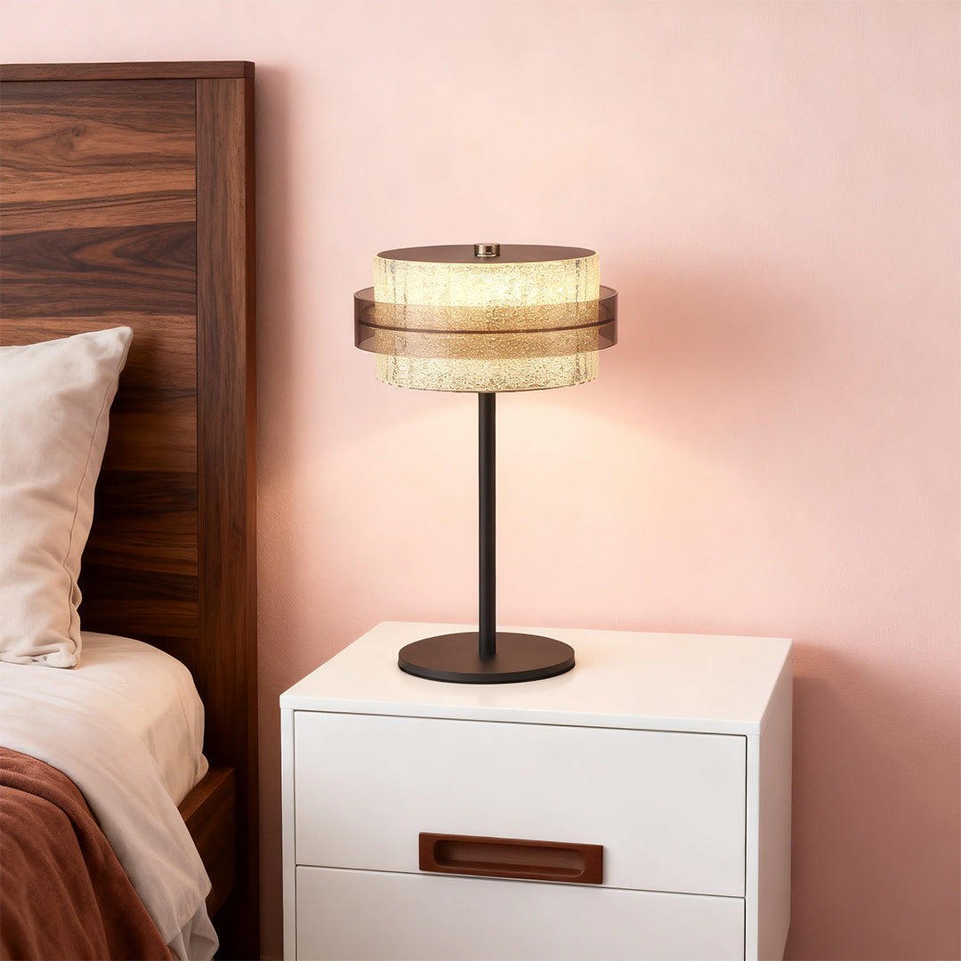 White nightstand with a dark brown and black vintage metal table lamp style, creating a cozy contrast.