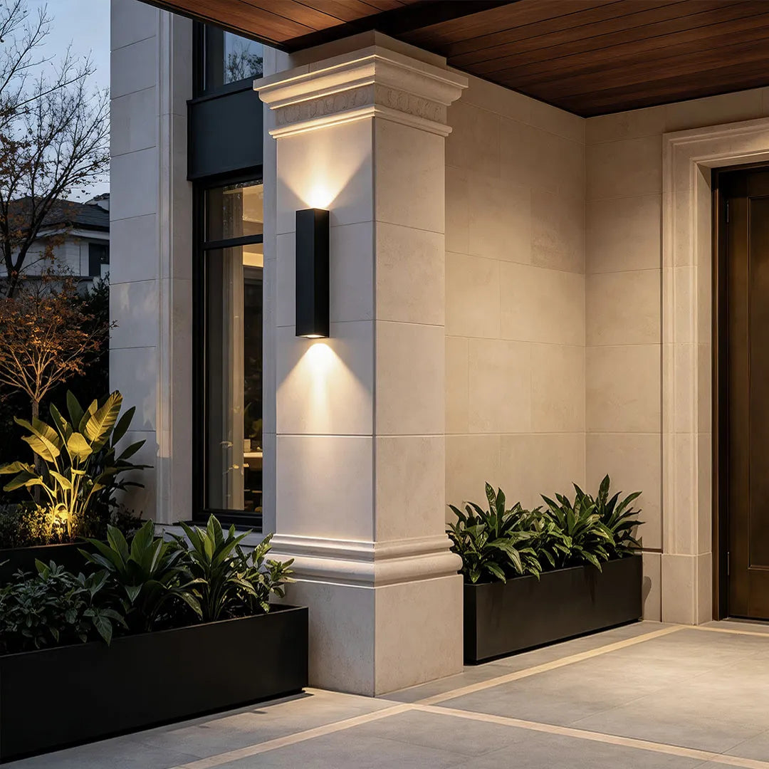 White outdoor up down wall light installed on a front porch column
