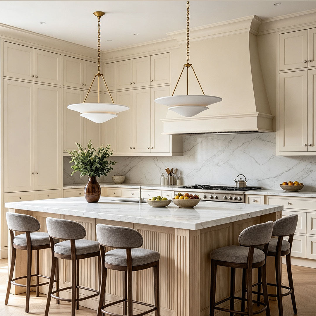 White plaster chandelier above a luxury kitchen island with modern classic interior decor.