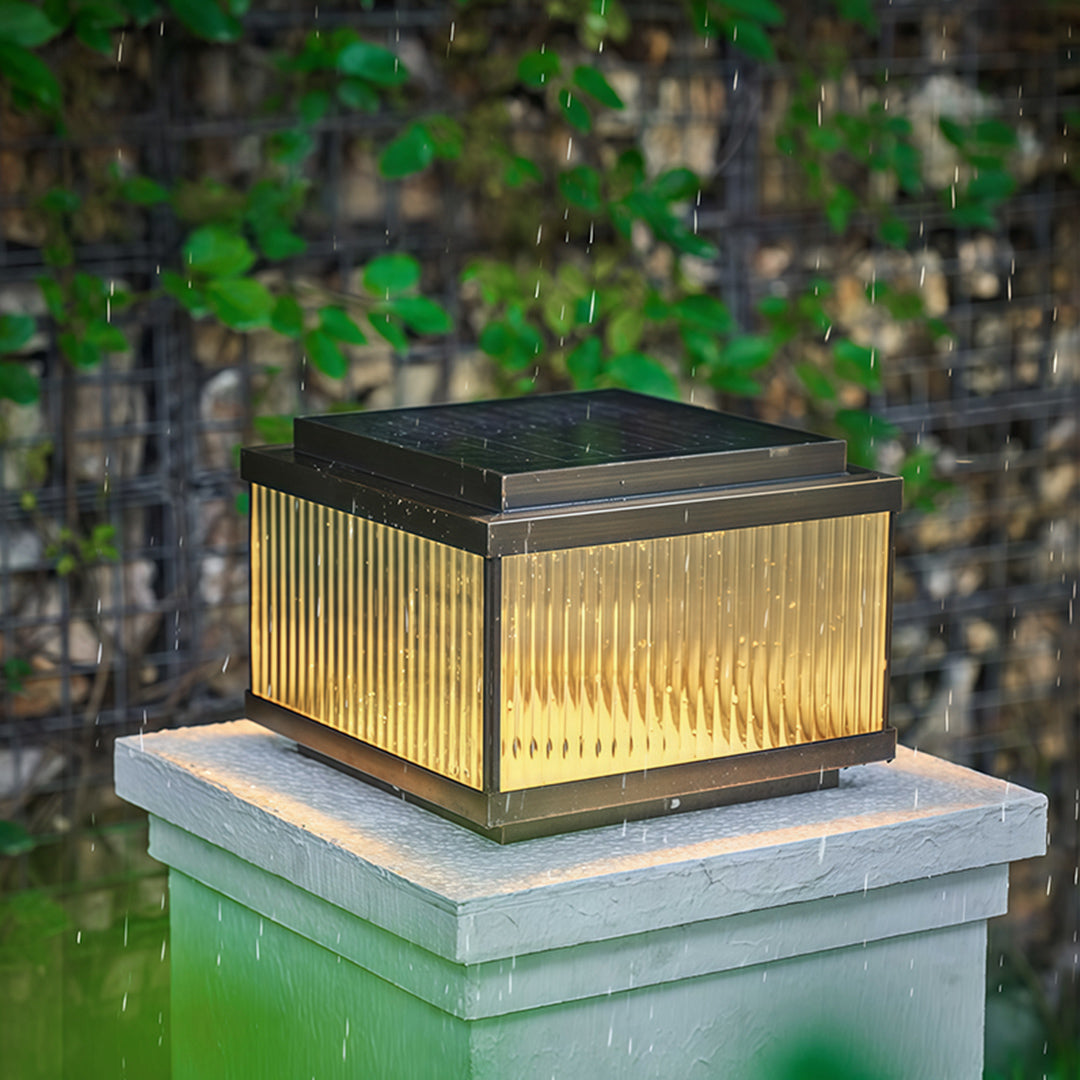 Close-up white copper pillar light displaying vertical slat design and architectural detailing