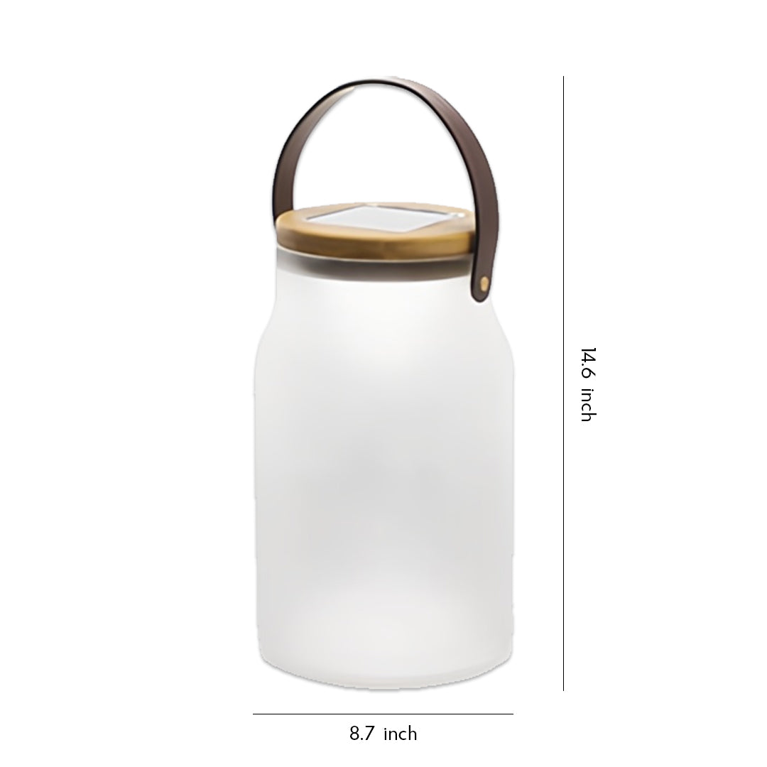 Minimalist white solar powered camp lantern with soft glow and leather-style handle against clean background.