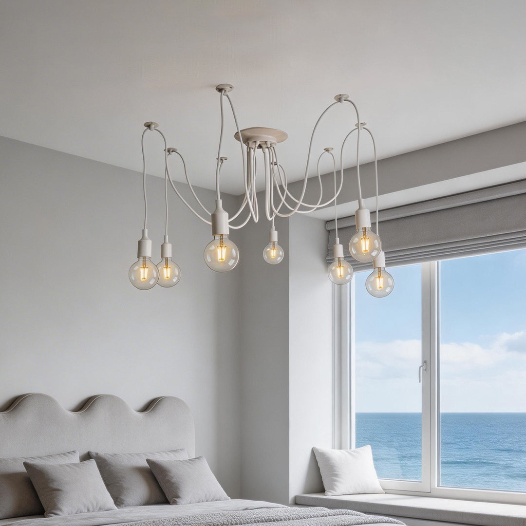 Minimalist white spider chandelier with Edison bulbs in a cozy bedroom.