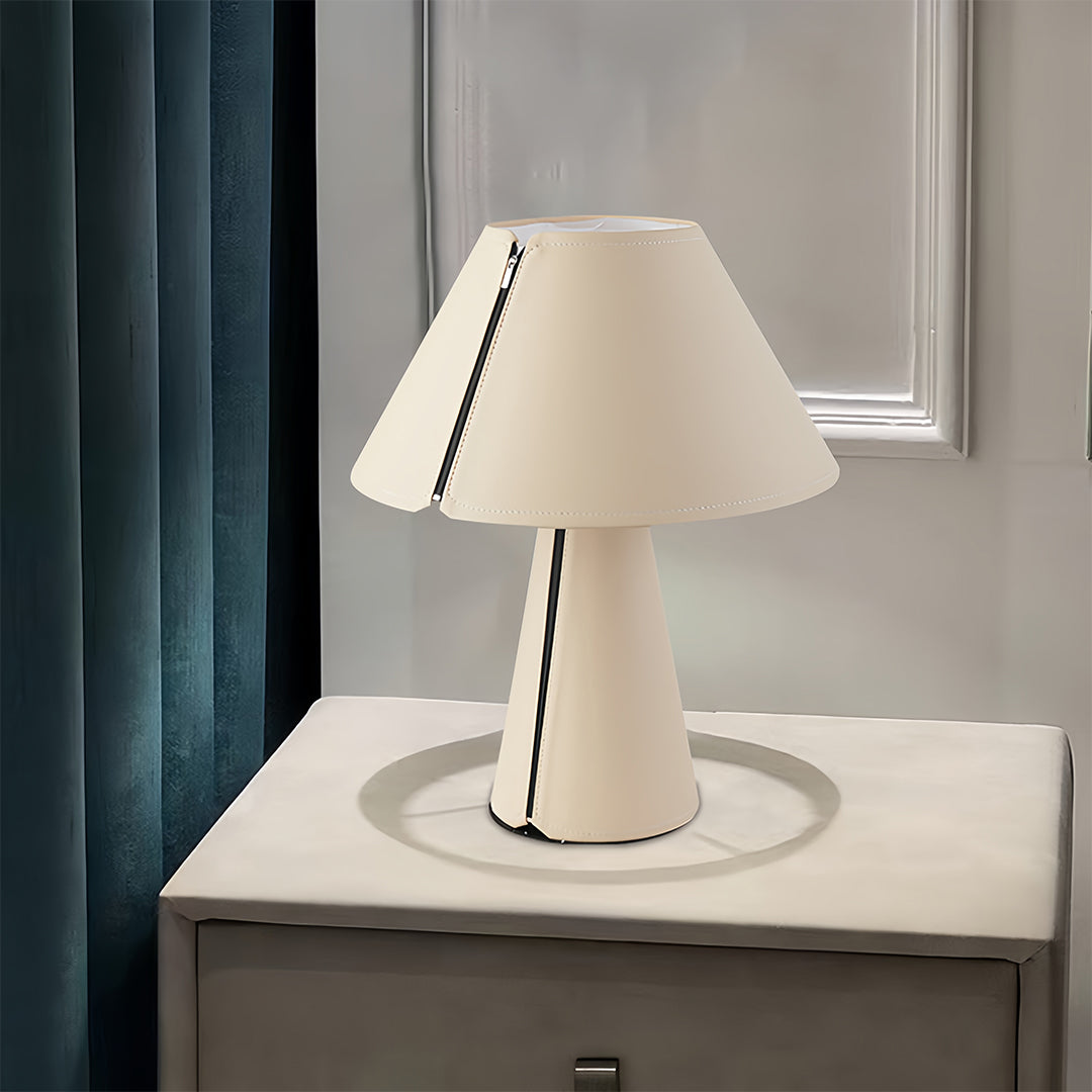White table lamp providing reading light on modern bedside table surface