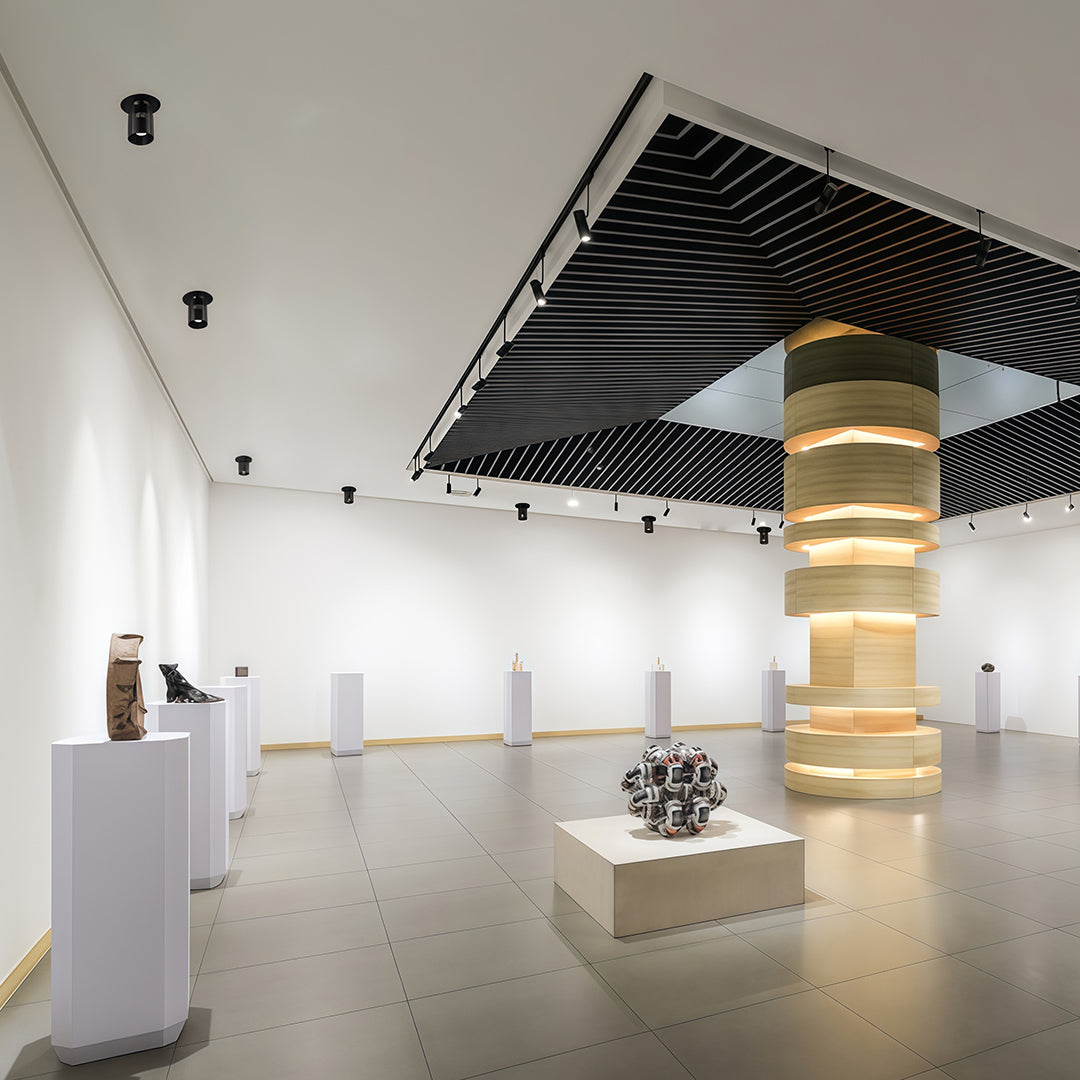 White adjustable LED downlight with textured interior, designed for even light distribution and modern aesthetic appeal.