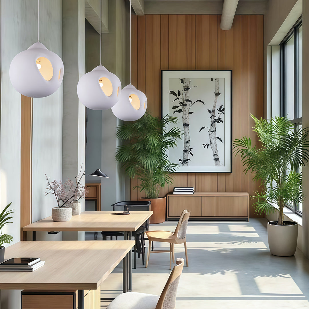 White Nordic Wabi Sabi Pendant Lights hanging in bright dining space with wooden accents and natural plants.
