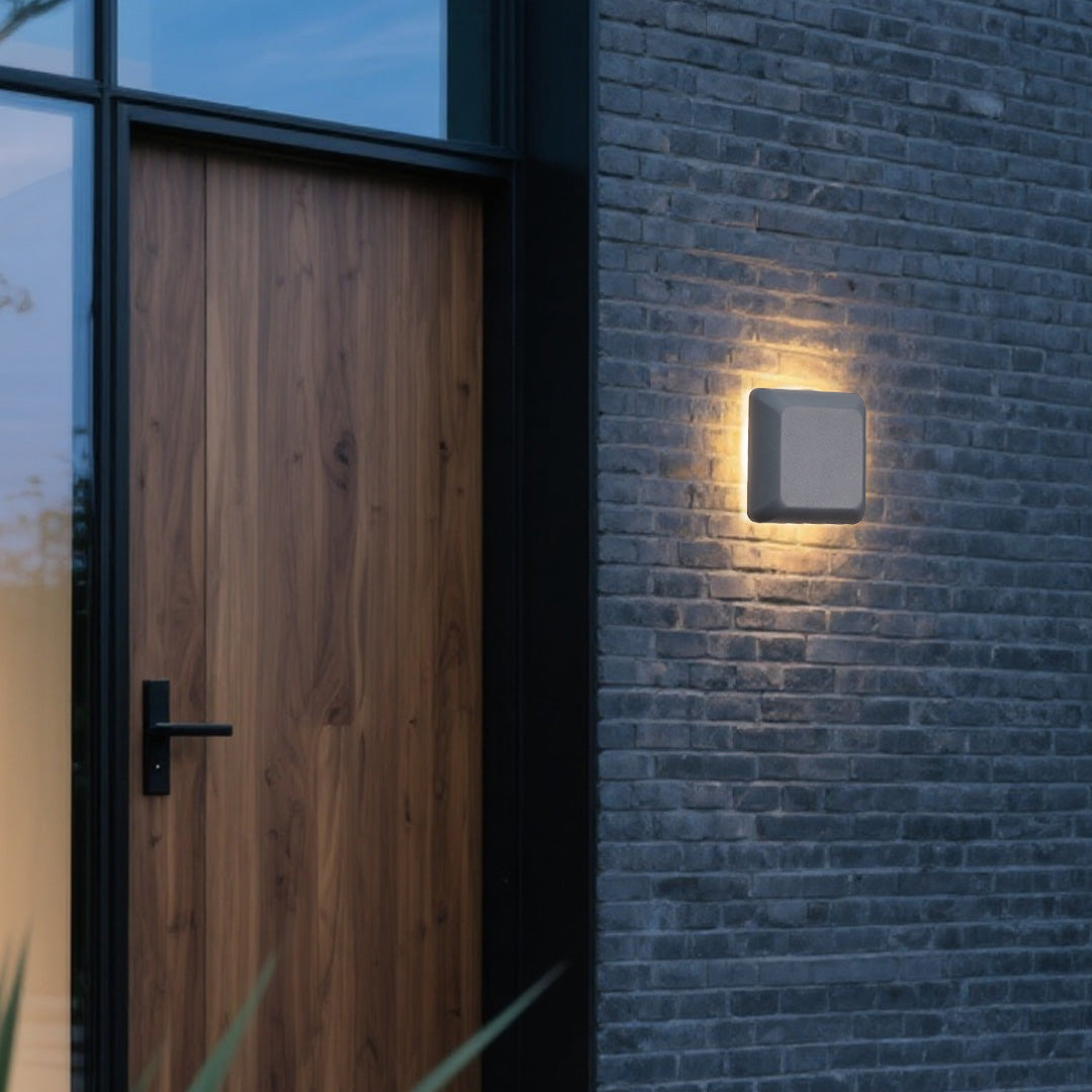 White waterproof outdoor wall light fixture shown on neutral background displaying mounting hardware