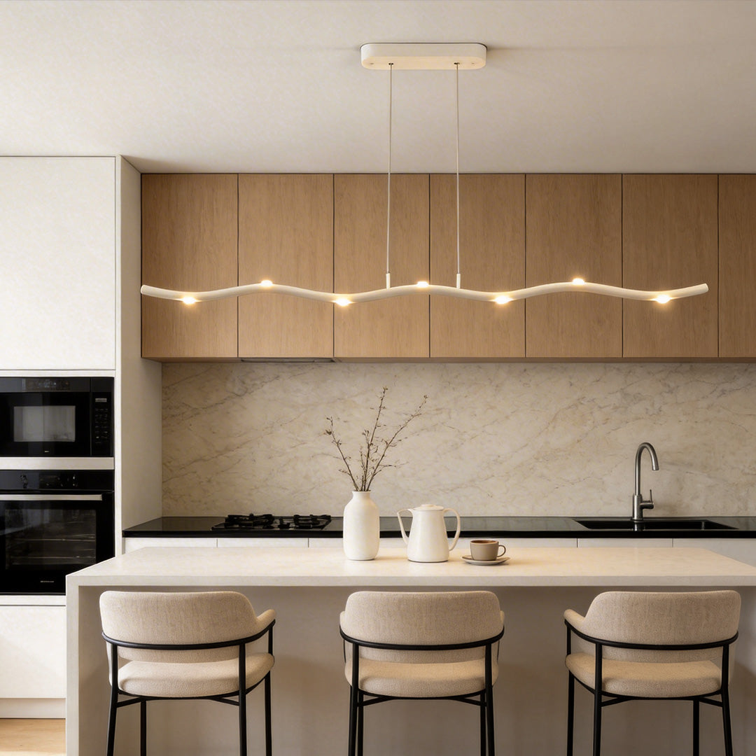 White wave pendant light providing ambient lighting in a contemporary dining room.