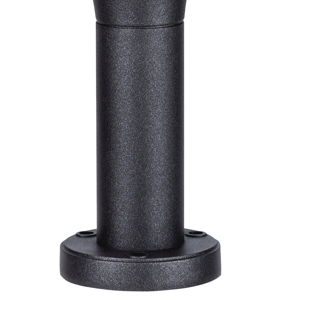 Short cylindrical bollard with wide base and textured finish for landscape lighting