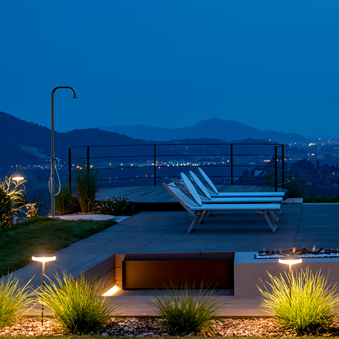 Wide exterior pathway lit by low-profile LED fixtures providing balanced outdoor lighting path effects.