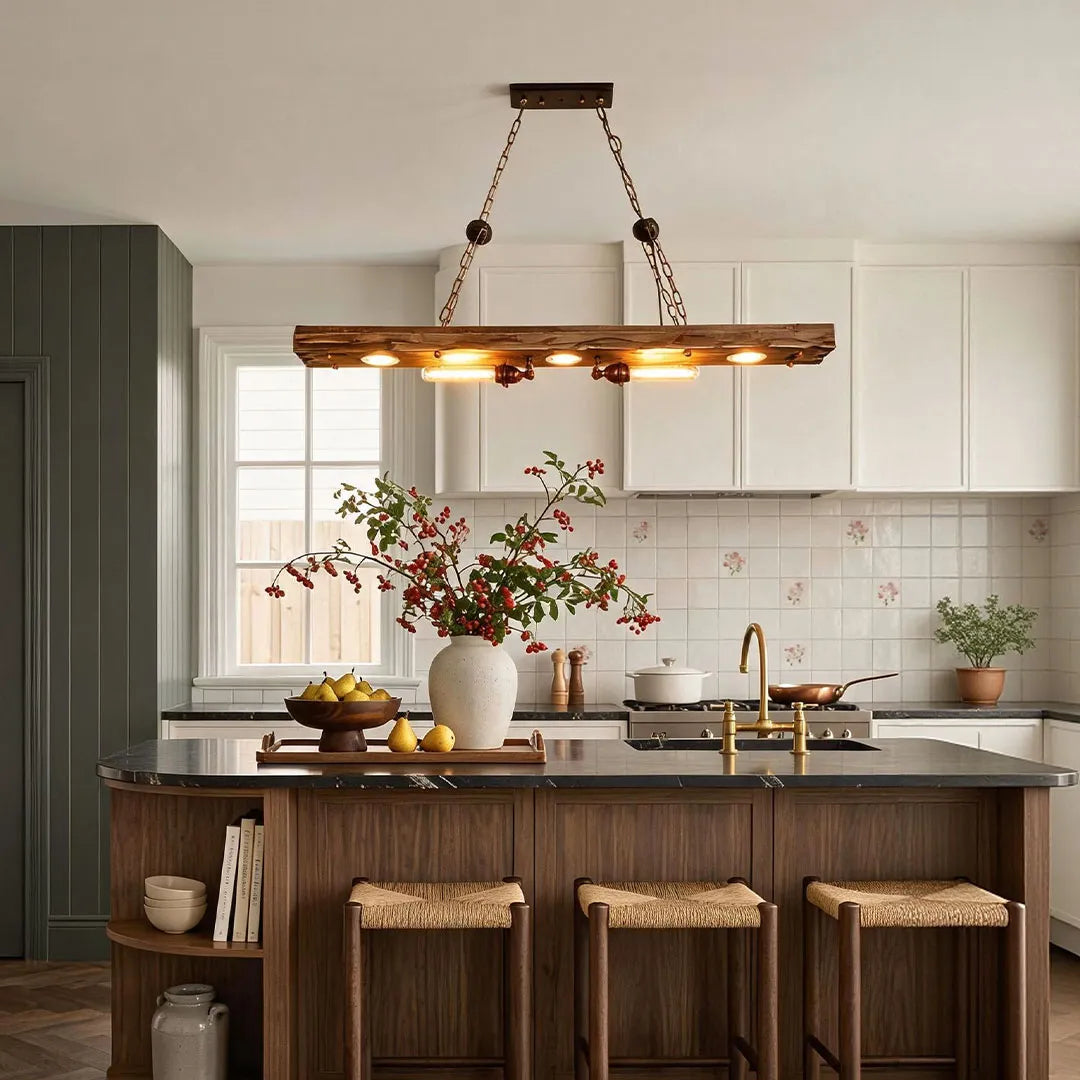 Wood and metal chandelier installed above a kitchen island with warm farmhouse-style lighting.