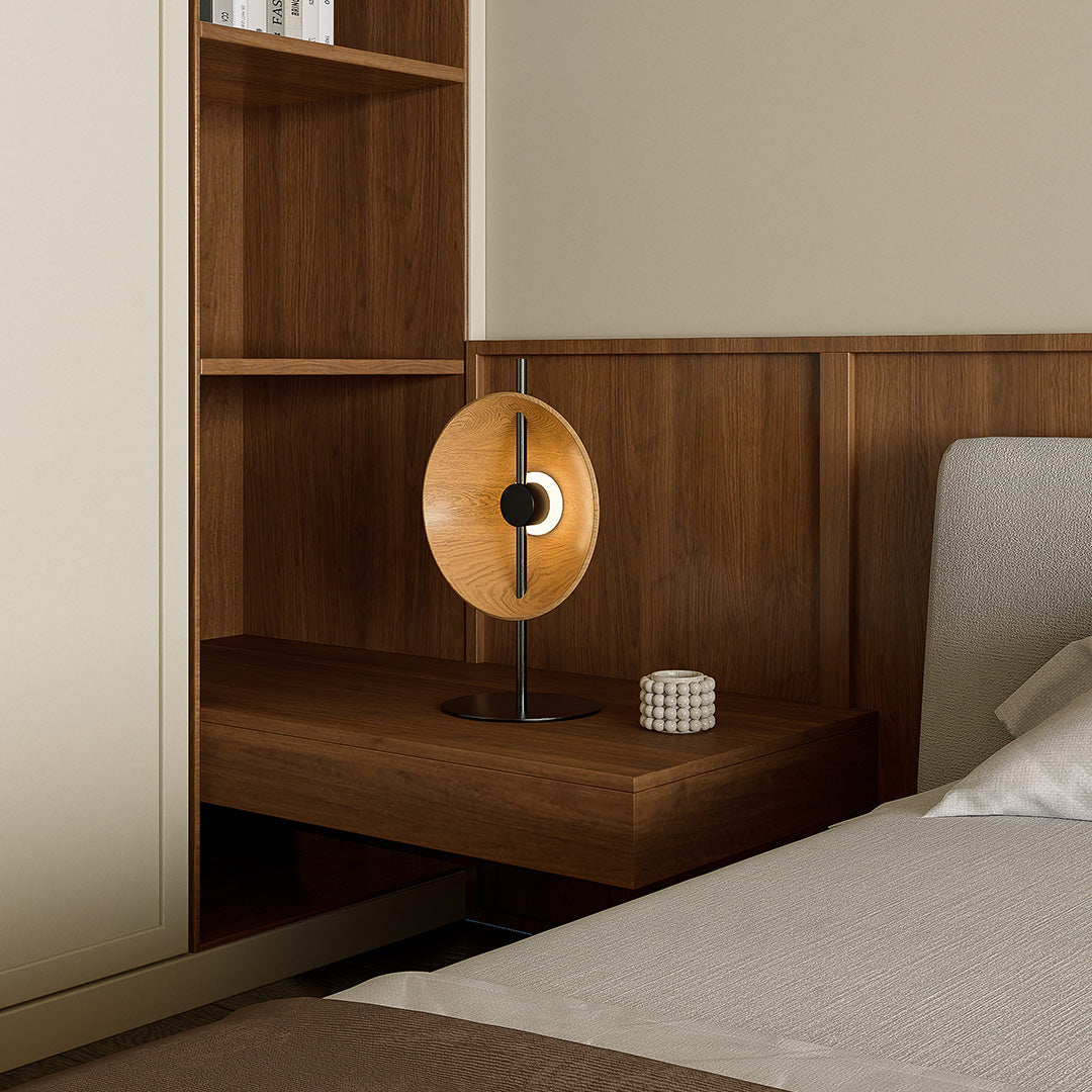 Wood modern table lamp on bedside desk blending with wooden wall interior.