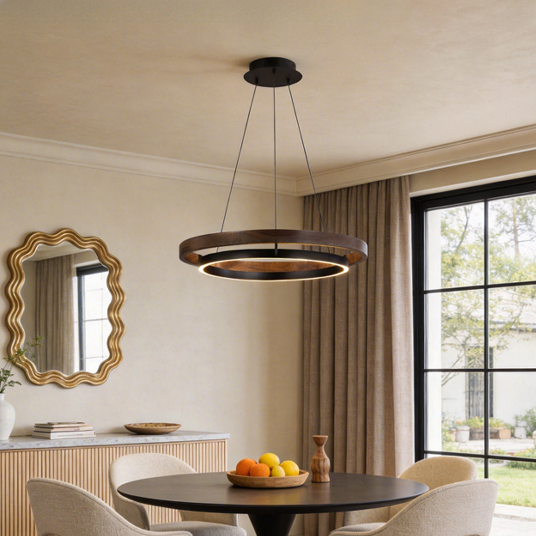wood finish dual ring chandelier with warm light above a dining table