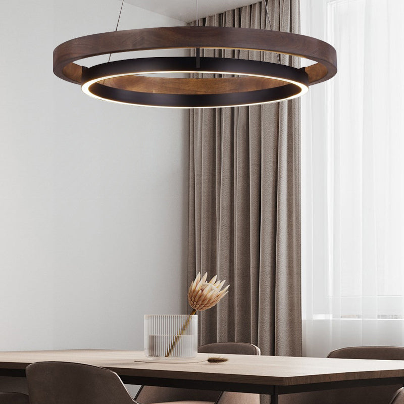 Wood ring pendant light with a natural wood finish, providing ambient light in a living room.
