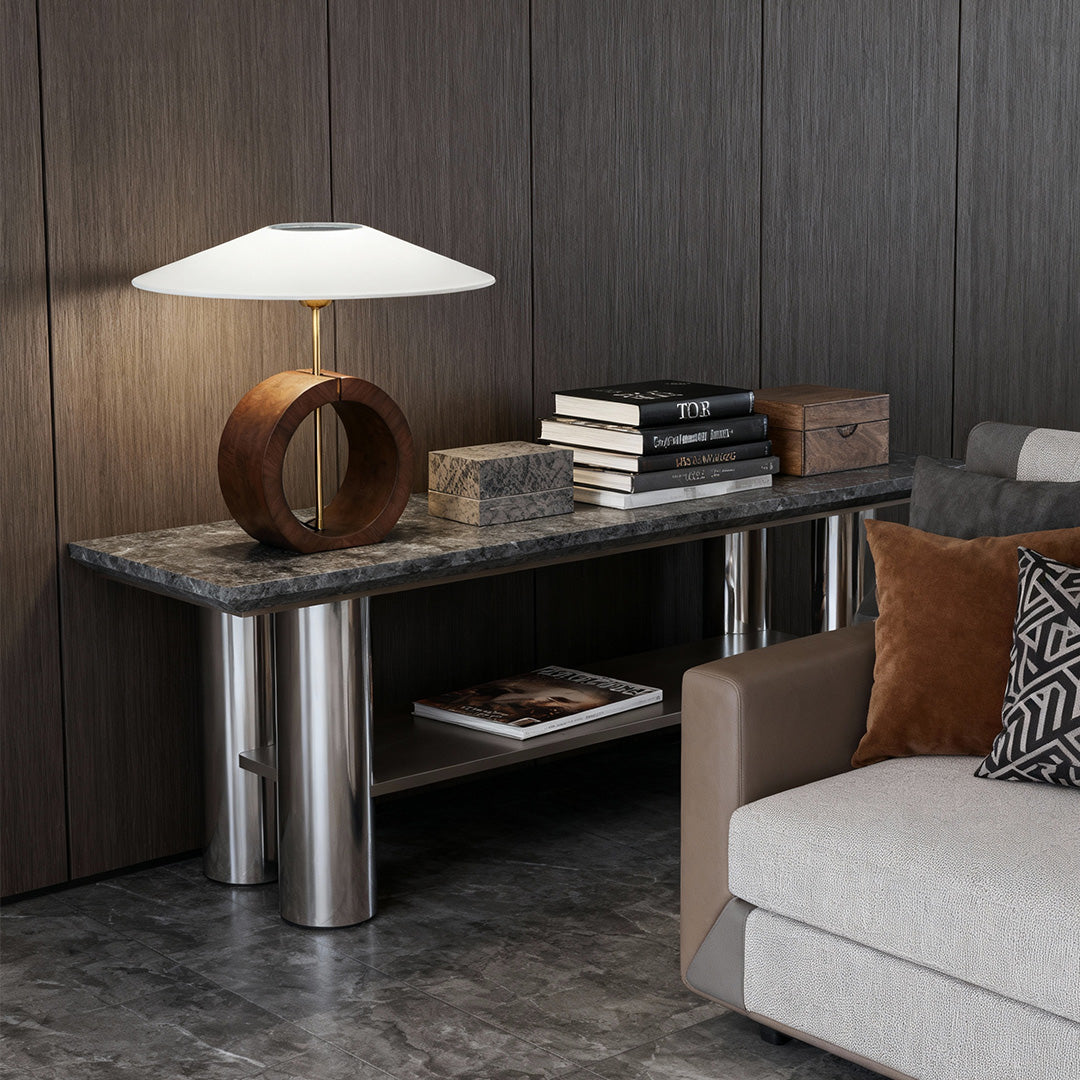 Wood table lamp with circular base and large white shade on sideboard table.