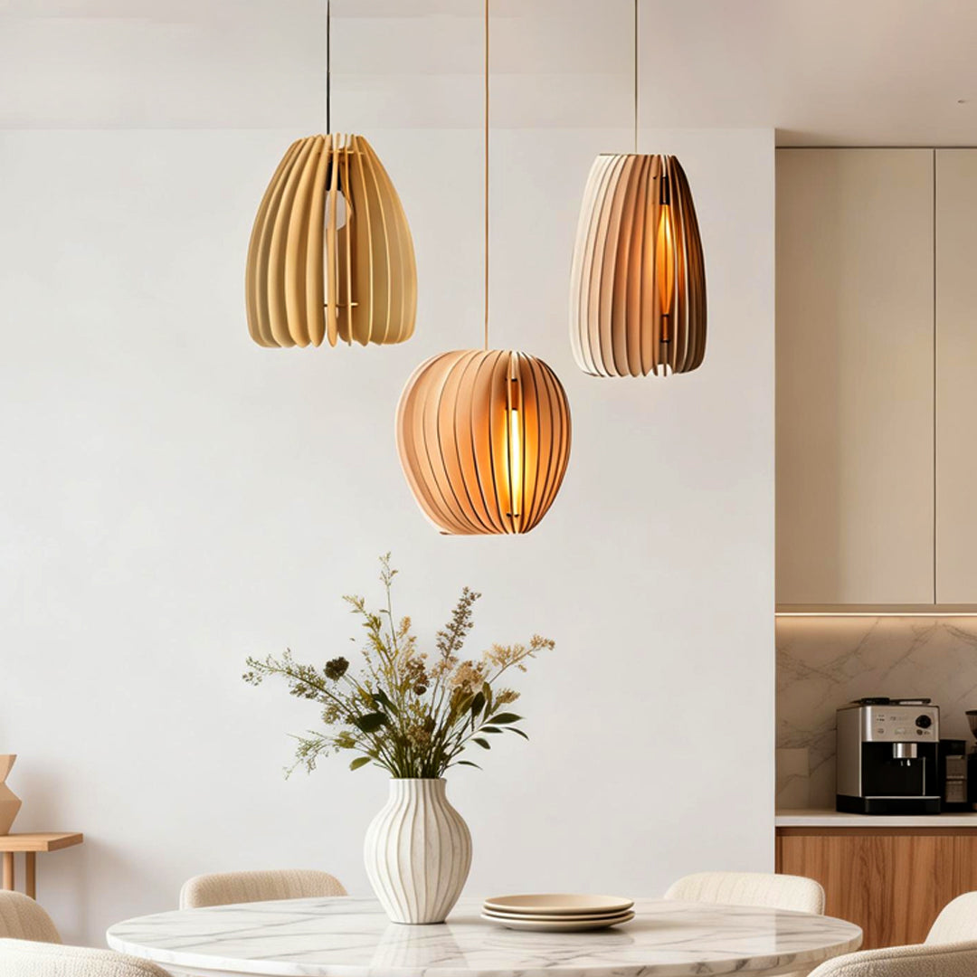 Wood slat pendant light providing soft illumination above a cozy kitchen island.