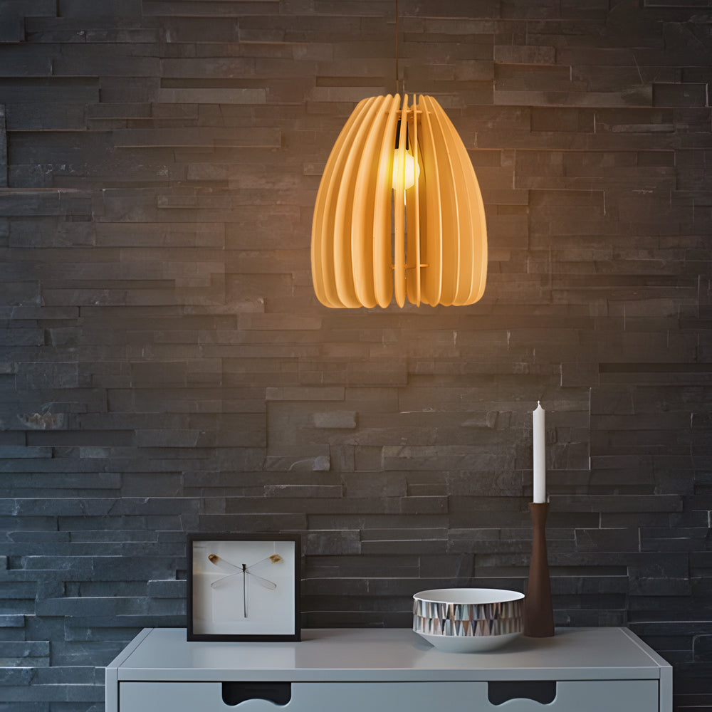Wood slat pendant light illuminating a stylish workspace with ambient light.