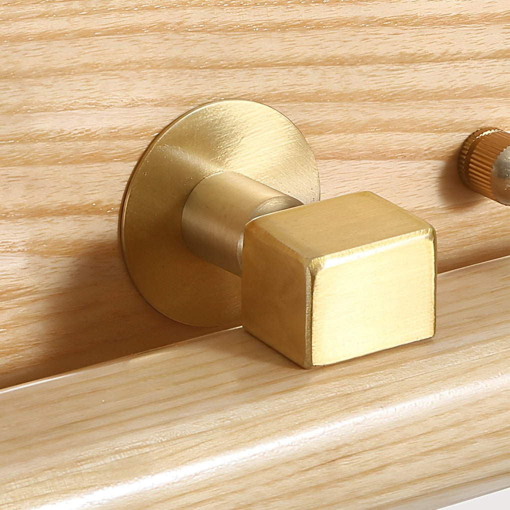 Close-up of square metal mounting base on a wood bathroom vanity light.