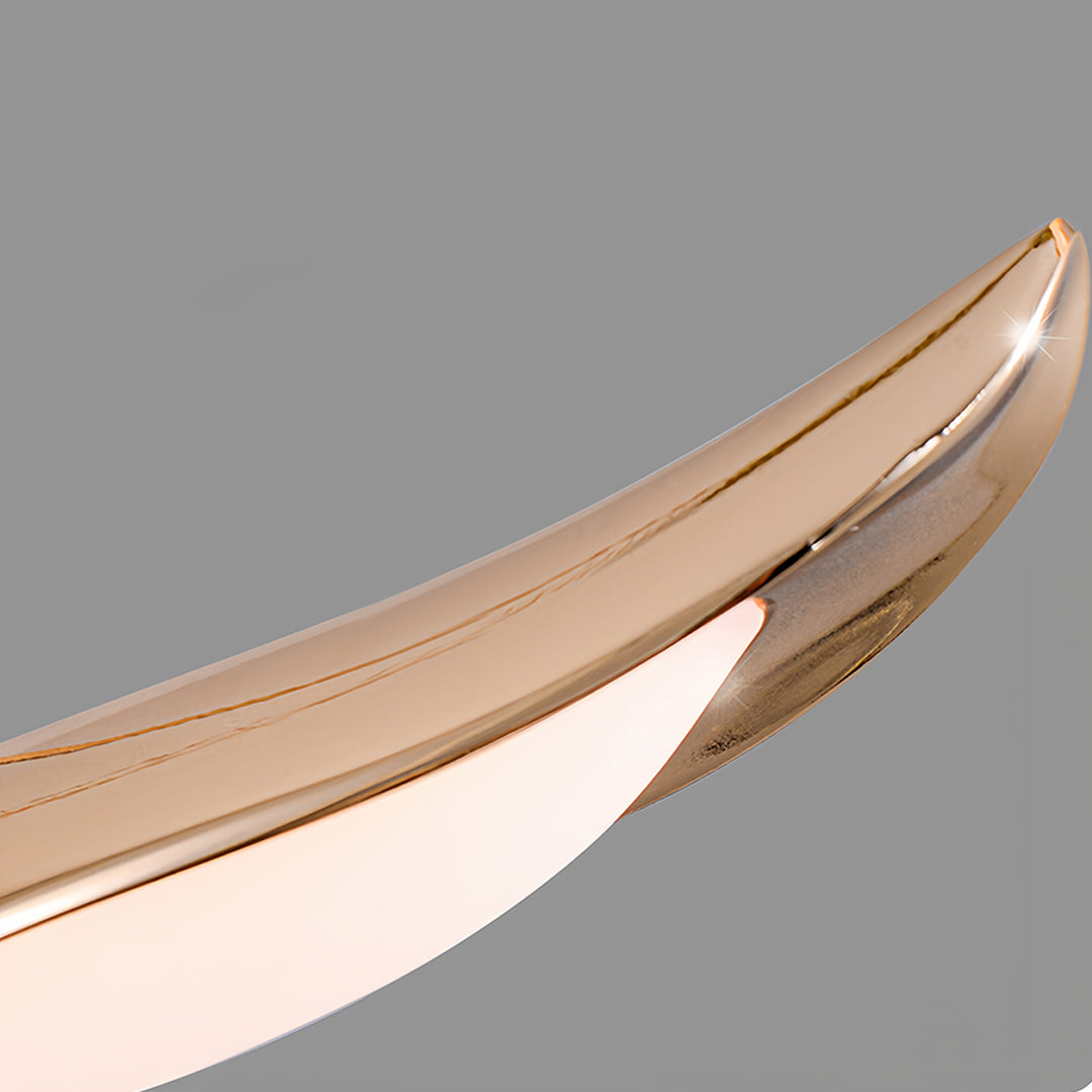 Close-up detail of wooden bird pendant light showing crafted natural grain texture