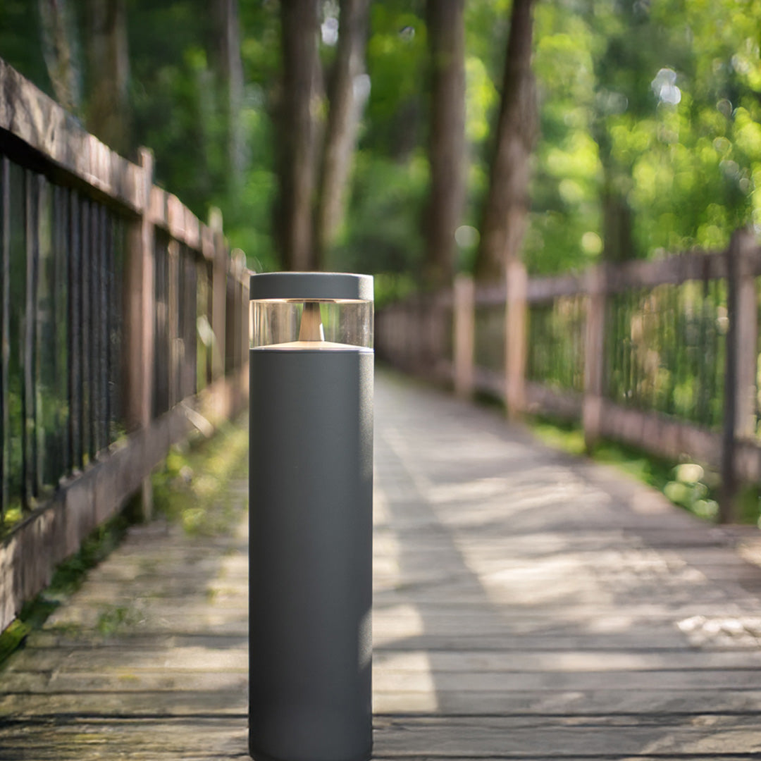 Pathway lights outdoor installed on wooden boardwalk creating safe navigation lighting through natural forest setting