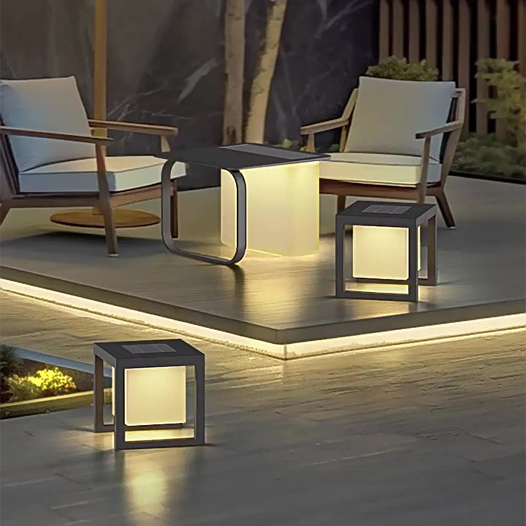 Wooden deck scene featuring illuminated cubic lights, handheld light convenience for outdoor entertaining