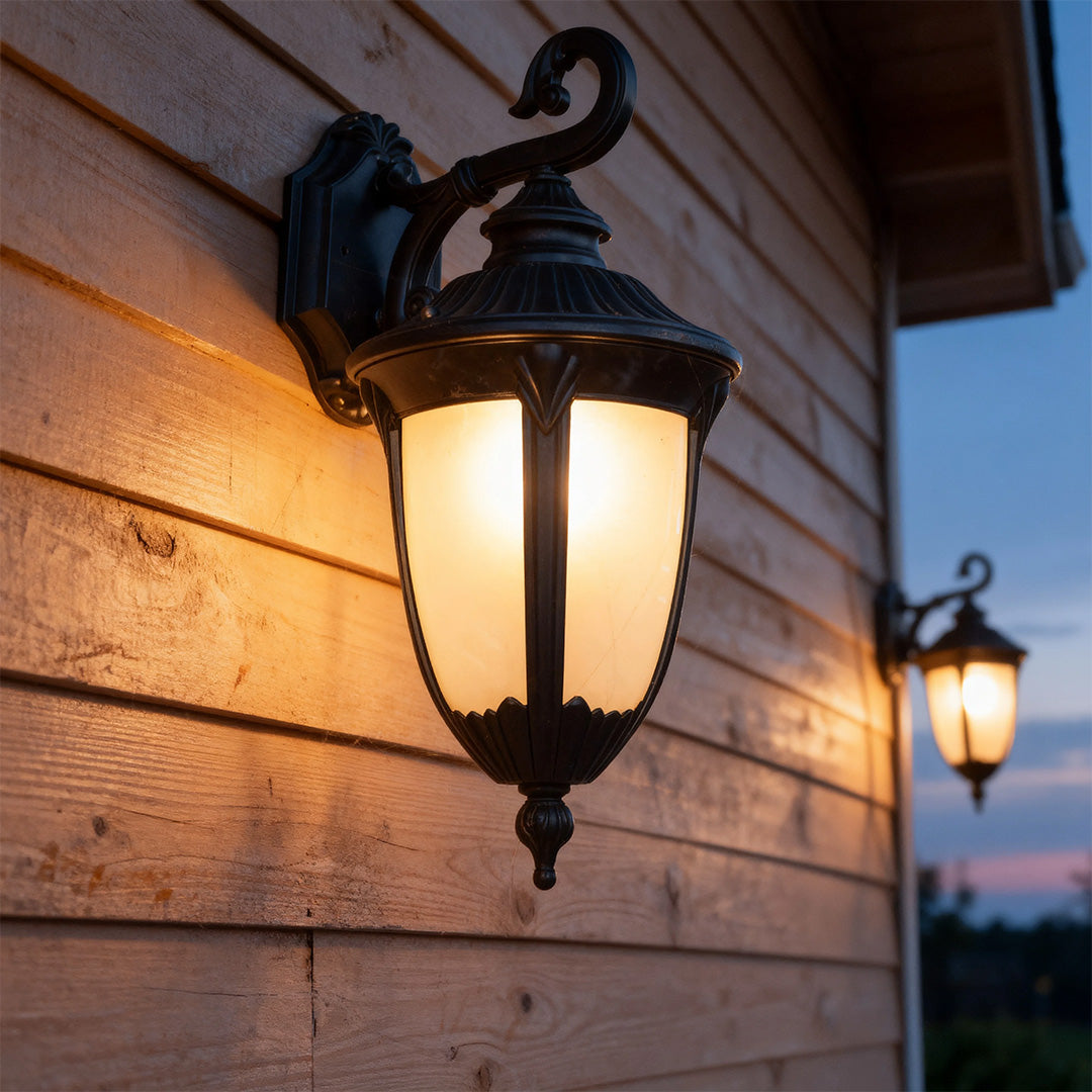 Outdoor black wall sconce on a wooden exterior, elegant and warm exterior lighting fixture