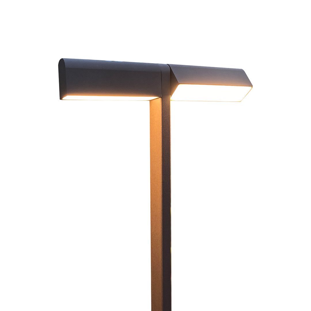 Dark-top pathway fixture paired with warm wooden pole, offering stylish contrast for led pathway lighting.