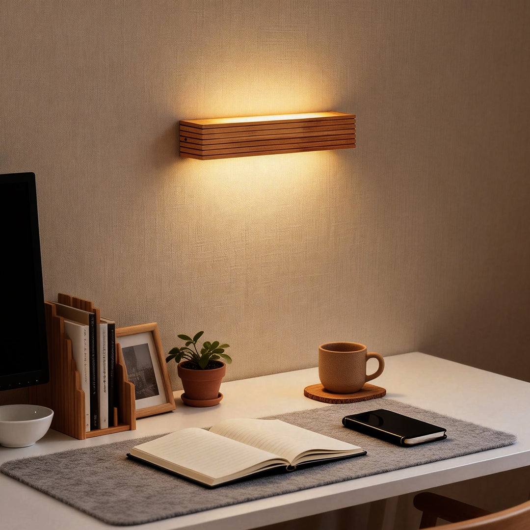 Wooden wall lamp installed above a study desk, providing soft accent lighting for a minimalist workspace.