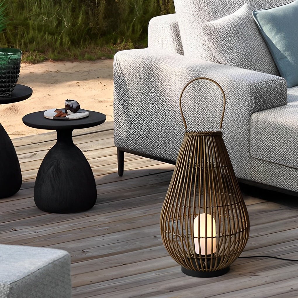 Woven bamboo lantern with a natural finish, providing soft light near a lounge chair.
