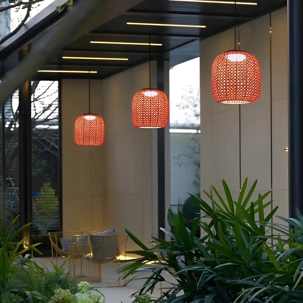 Woven hanging lantern with a modern design, illuminating an outdoor seating space.