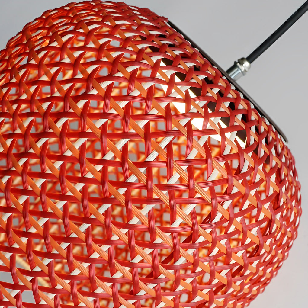 Woven hanging lantern with a red finish, providing soft light in a contemporary patio.