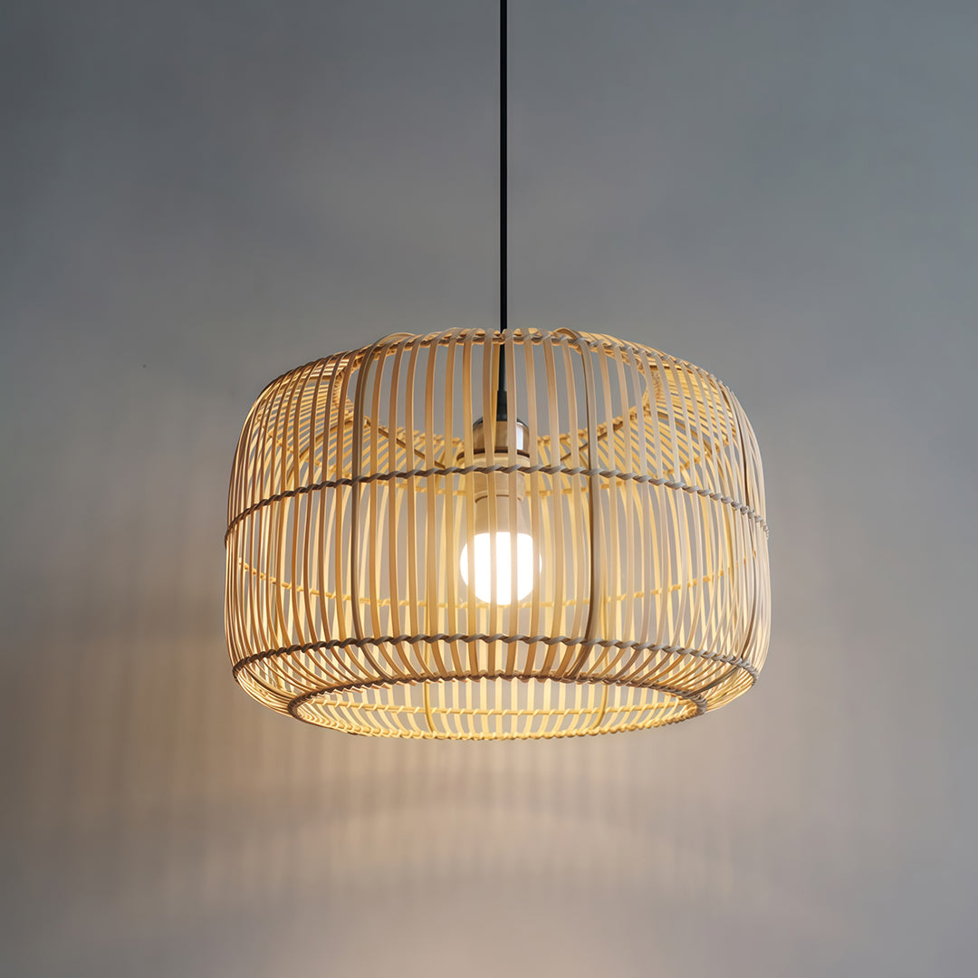 A group of woven pendant lights hung over a modern bar, combining rustic design with sleek lighting.