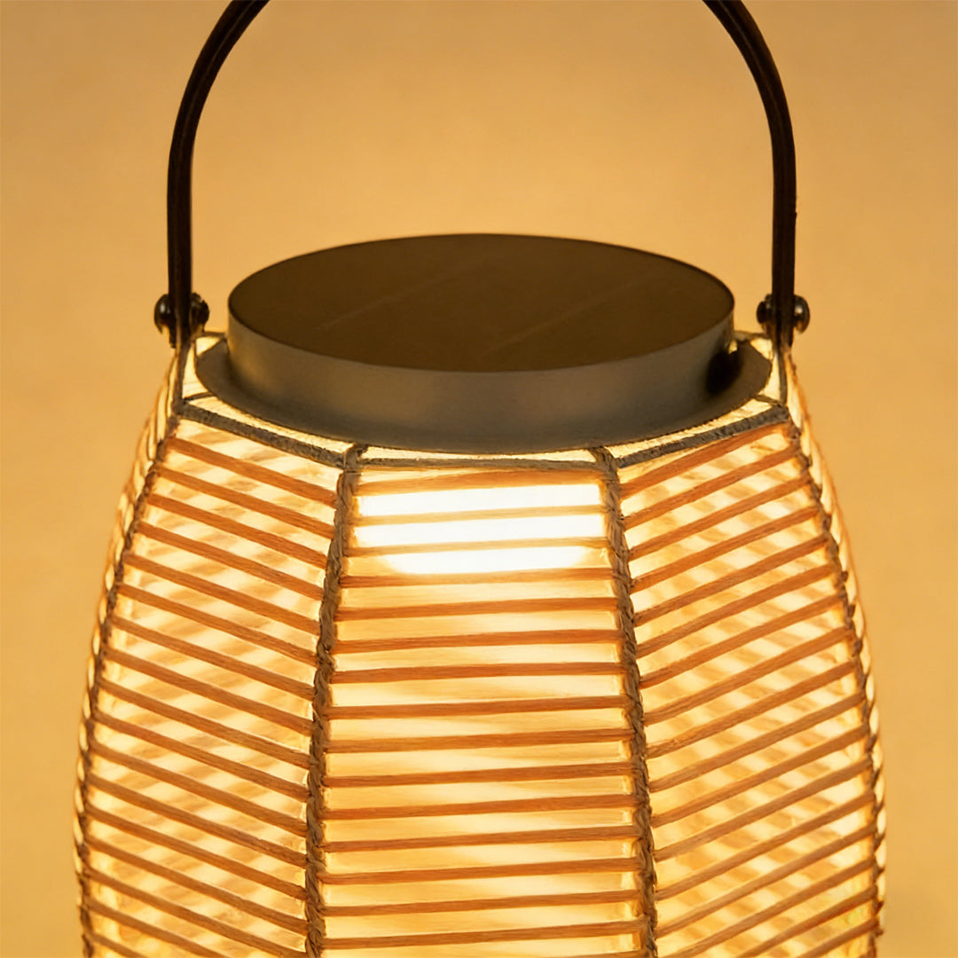 Woven rattan lanterns with a sleek design, placed on a wooden deck.