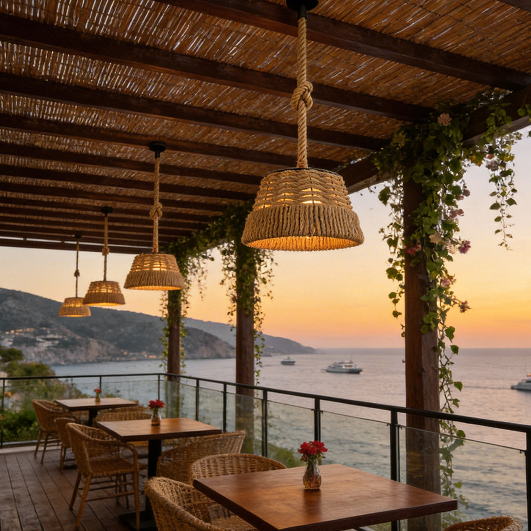 Woven rope pendant lights enhancing a seaside dining space with ambient glow.