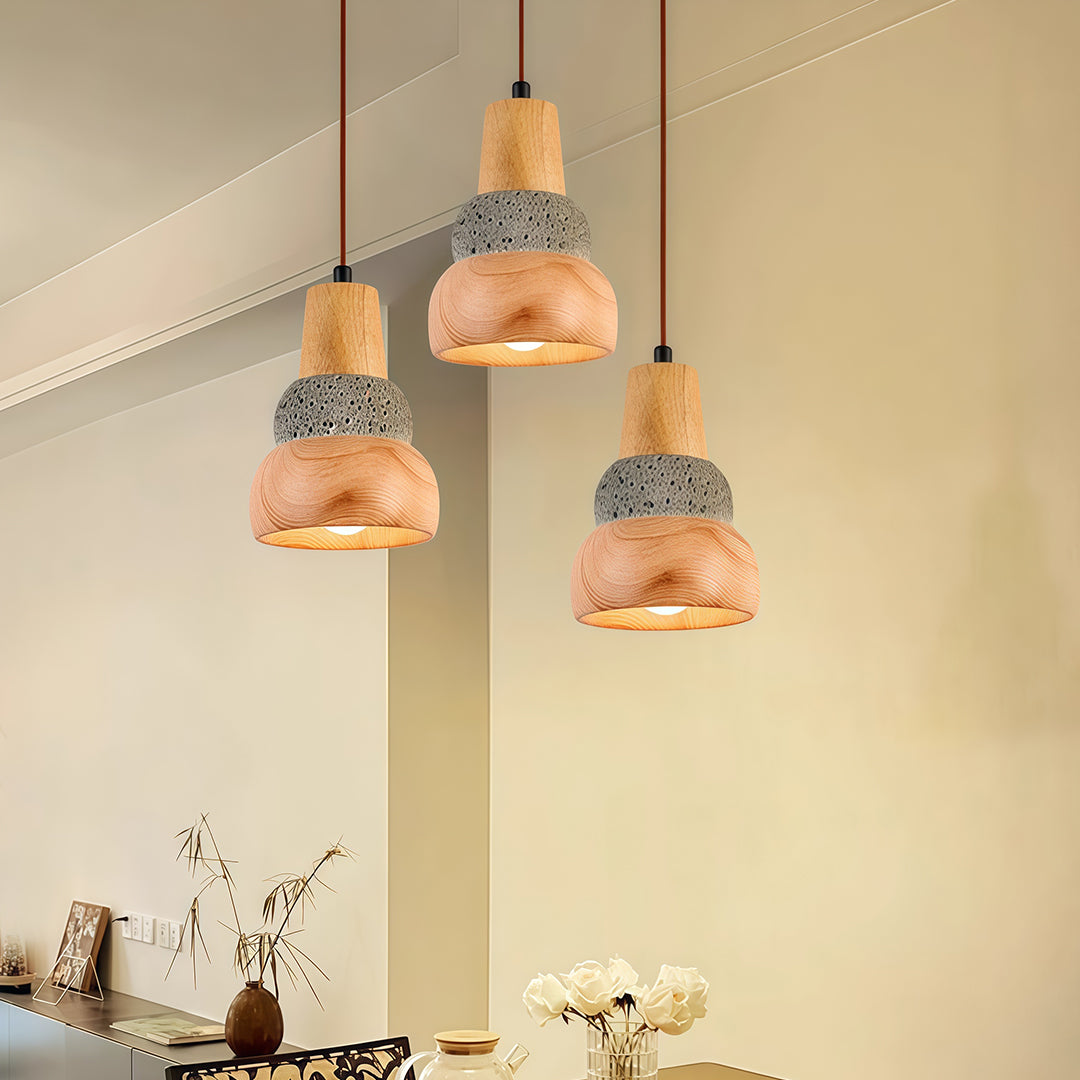 A pair of wood pendant lights with a natural woven texture, adding character and warmth to a modern interior.