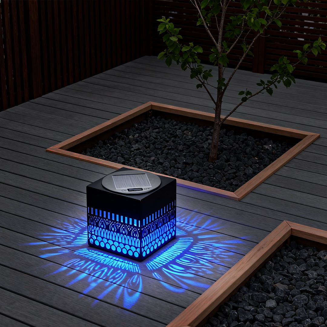 Landscape corner design featuring a cube with colorful LED projection, inspired by wrought iron outdoor wall lights styling.
