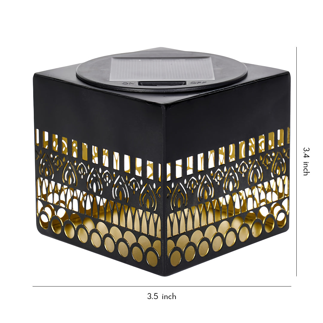 Decorative wrought iron outdoor wall lights styled as a square lantern with intricate cutout patterns and warm illumination.