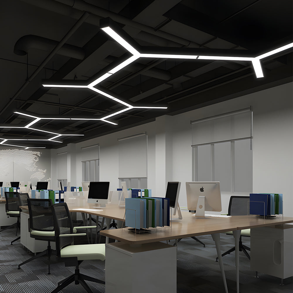 Y shaped linear ceiling lights in a modern office environment