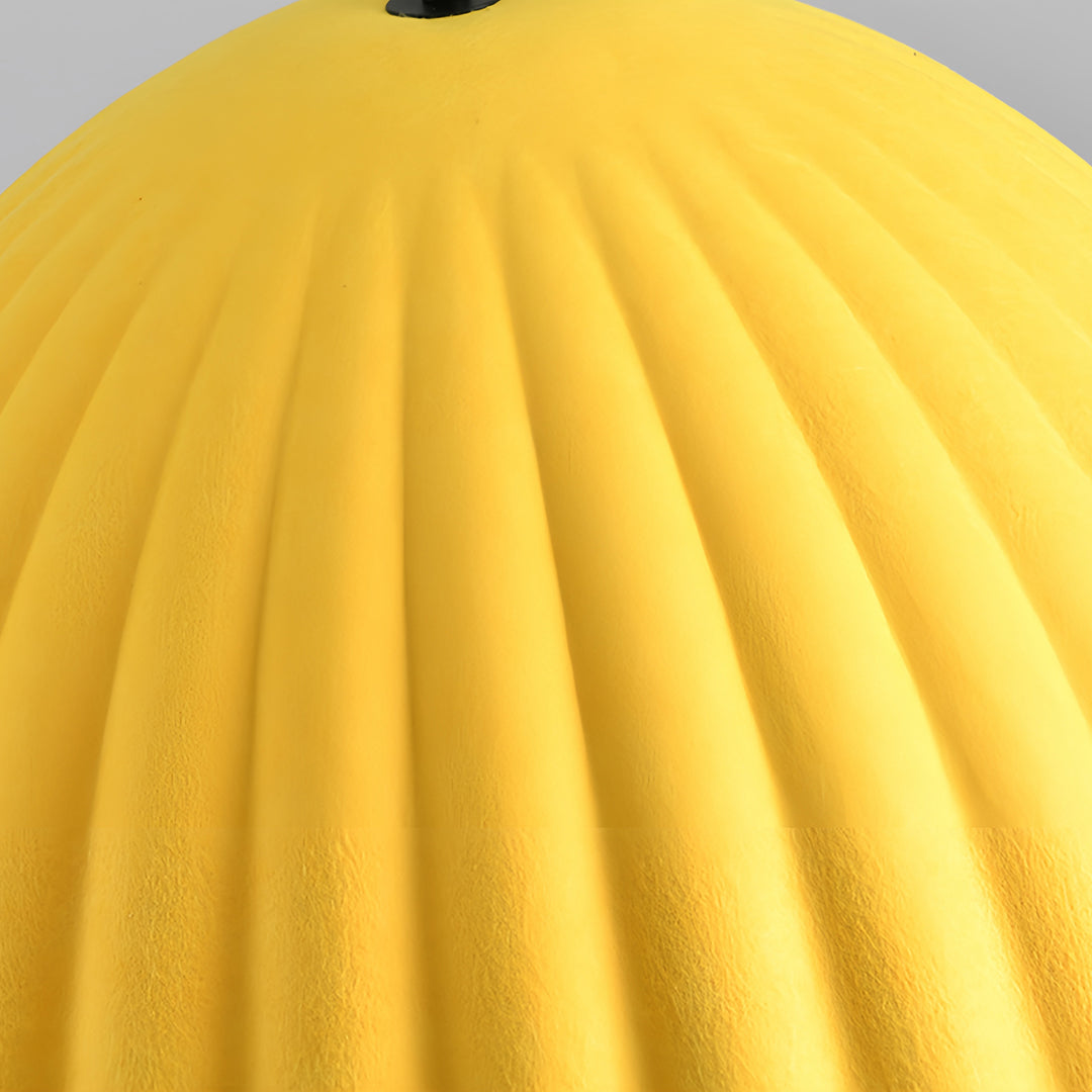 Close-up texture detail of a bright yellow ribbed lampshade, matching the style of the gray pendant light series.
