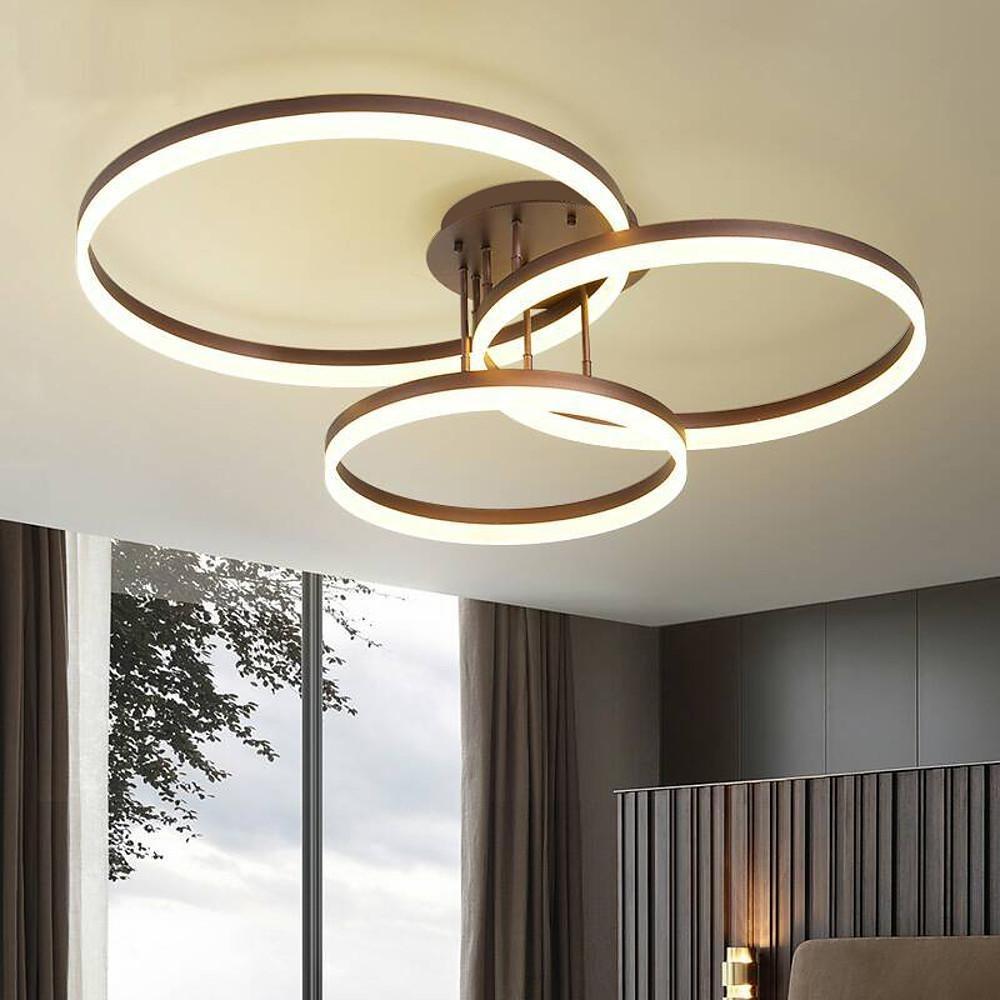 Modern 3-ring flush mount ceiling light with warm LED rings installed in a contemporary living room.