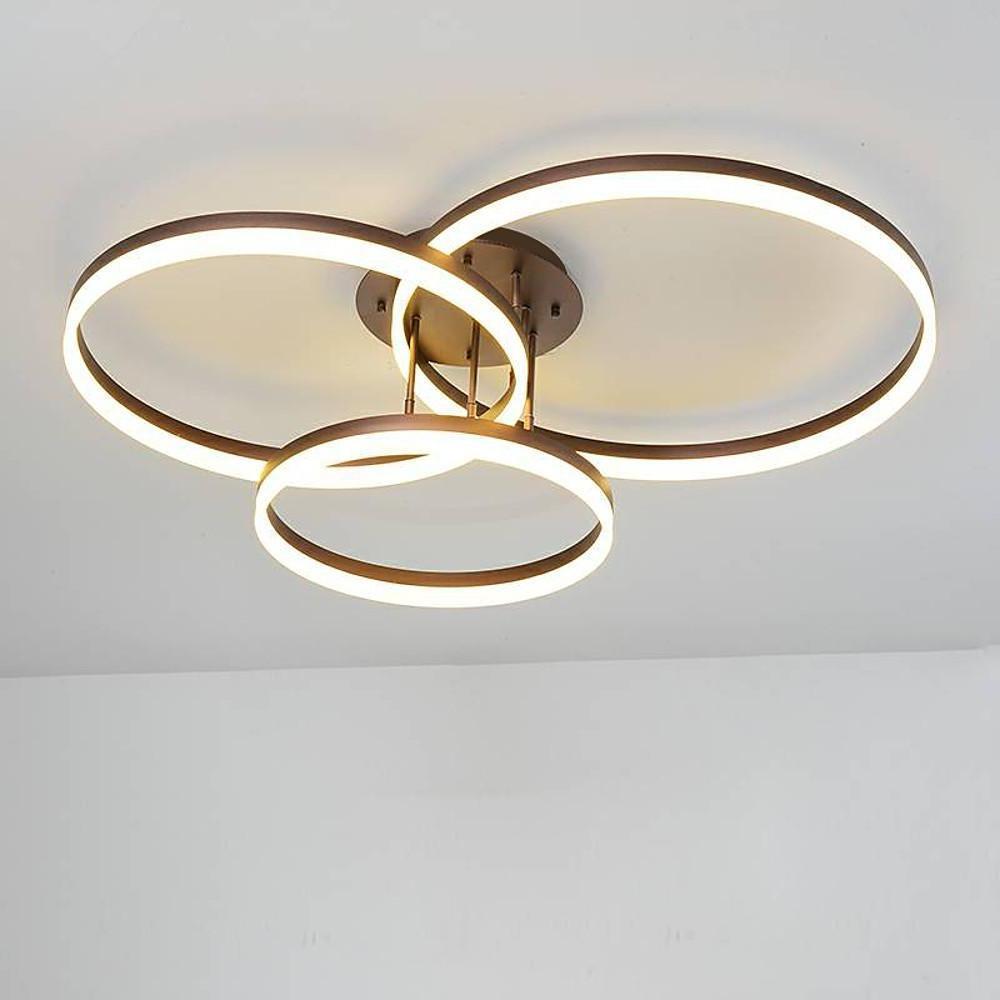 Modern 3-ring flush mount ceiling light featuring overlapping circular LED rings in a neutral interior.