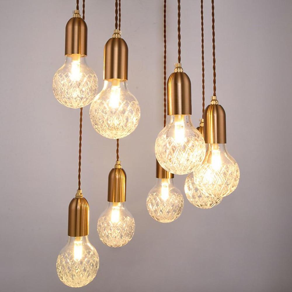 Cluster acrylic bulb chandelier with warm ambient lighting.