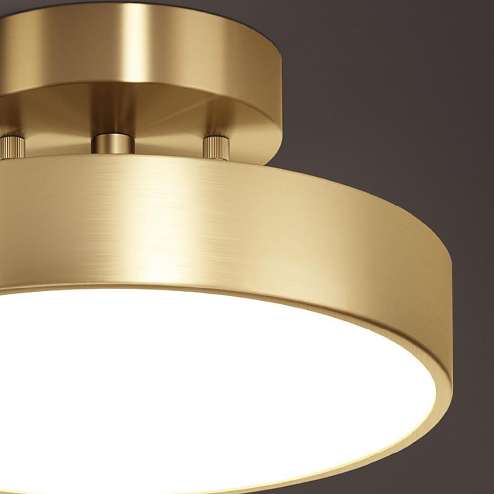Close-up detail of a gold adjustable LED ceiling light fixture.